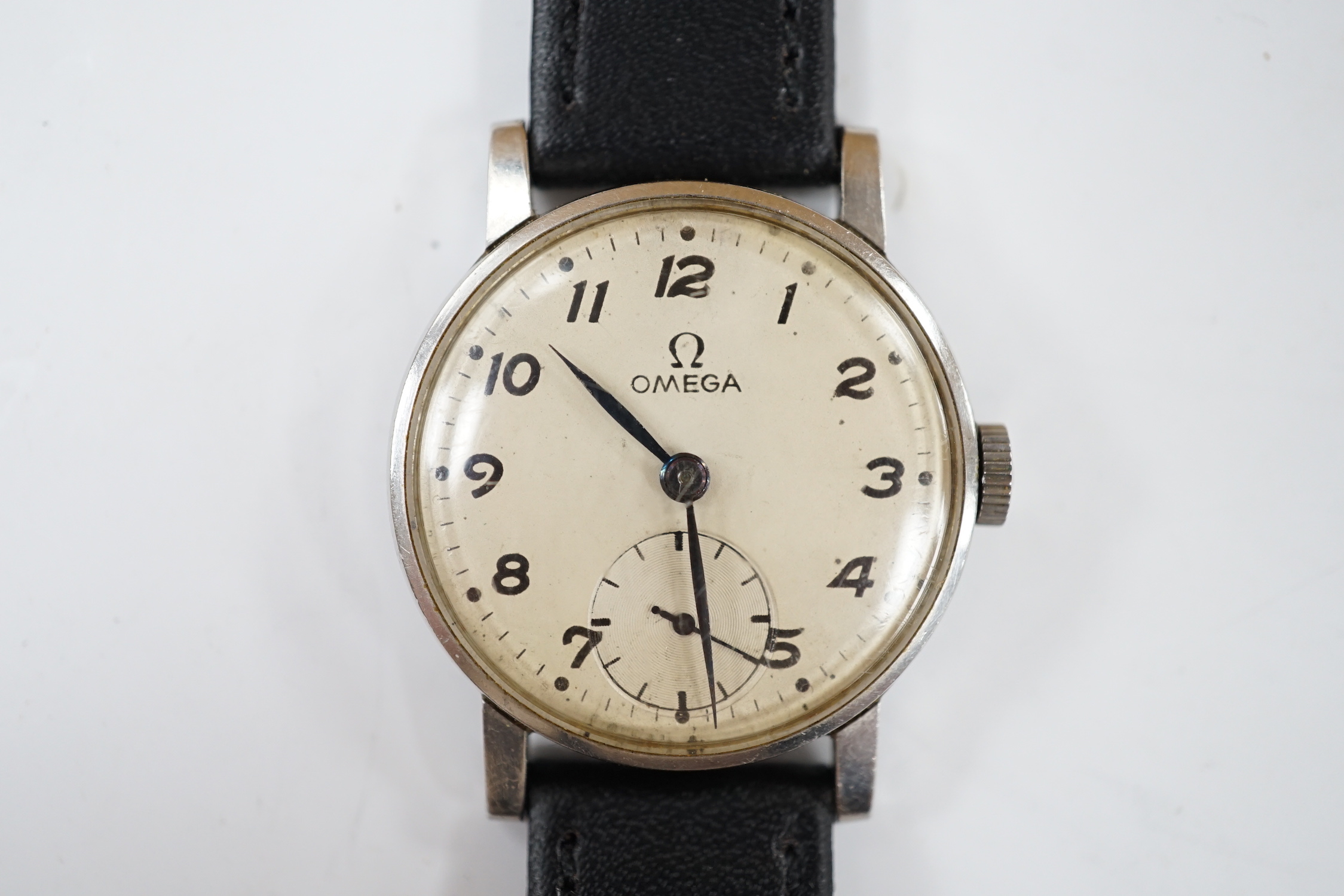 A gentleman's stainless steel Omega manual wind wrist watch, with subsidiary seconds, on later associated leather strap, case diameter 30mm, no box or papers.